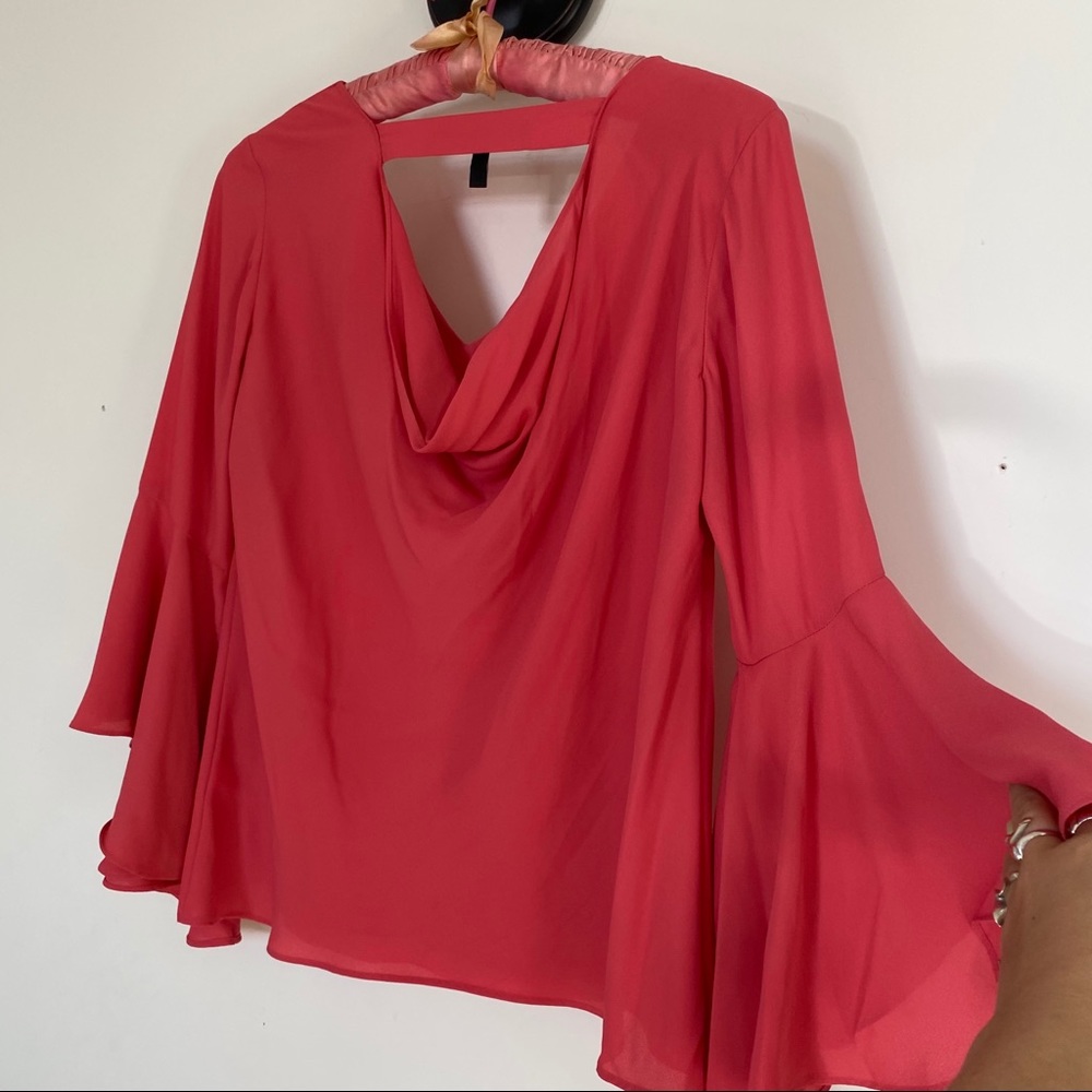 Babydoll bell sleeve blouse in a saturated pink